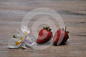 Strawberries displayed with an African Iris