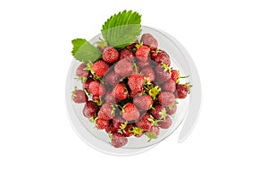 Strawberries on a glass plate isolated on white background. Red ripe berries, fresh juicy strawberries, top view