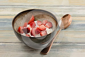 Strawberries and greek yogurt in bowl