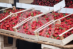 Strawberries from grocka fresh and red, for sale on a market in Belgrade, Serbia piled on a stall in a pijaca.