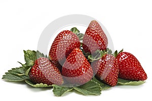 Strawberries with leaves isolated over white.