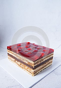 Strawberries opera chocolate cake white background
