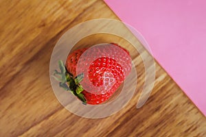 Strawberries in a pink background photo