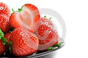 Strawberries on plate isolated on white background