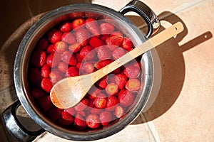 Strawberries in a pot for a jam