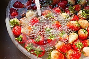 Strawberries soaked in water.