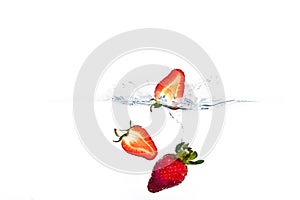 Strawberries Splashing through Water