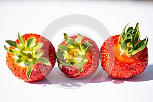 Strawberries strung, white background