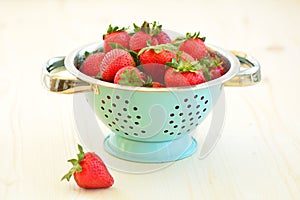 Strawberries in vintage colander