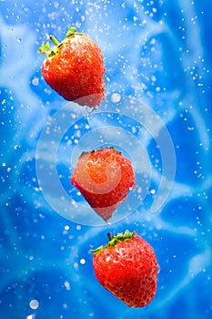 Strawberries in a water splash