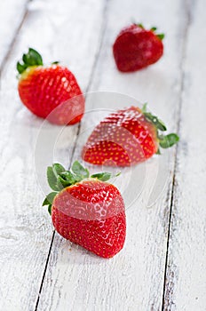 Strawberries on white wooden