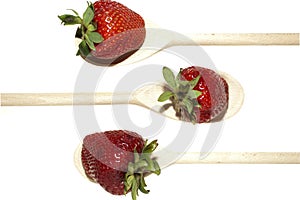 Strawberries on wooden spoon