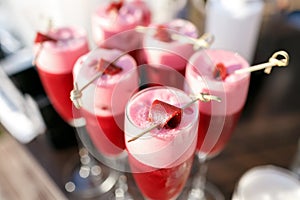 Strawberry alcoholic cocktail drinks and fruit.