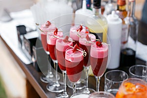 Strawberry alcoholic cocktail drinks and fruit.