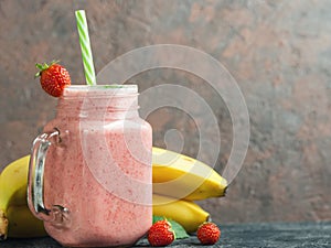 Strawberry banana smoothie in a glass jar. Healthy and healthy summer Breakfast