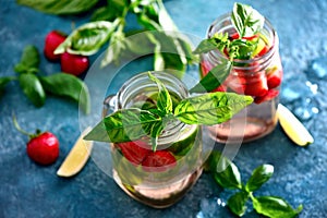 Strawberry and basil limeade in two glass jars