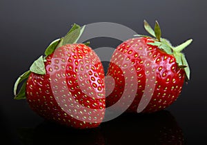 Strawberry berry on black