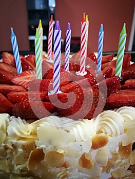 Strawberry birthday cake with candles photo