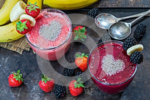 Strawberry and blackberry smoothies garnished with chia seeds