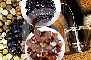 strawberry, blueberry, grape on wine corks, bottle of wine, antioxidants, resveratrol flavonoids rich food photo