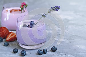 Strawberry, blueberry smoothie on light background. well being and weight loos concept. milkshake with fresh berries. healthy photo