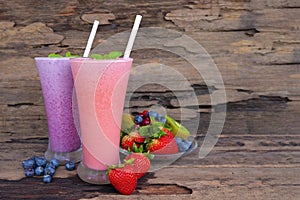 Strawberry and blueberry smoothies colorful fruit juice,beverage healthy the taste yummy In glass drink food for breakfast and sna