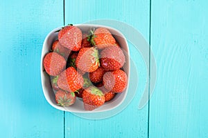 Strawberry Bowl On Blue Wood
