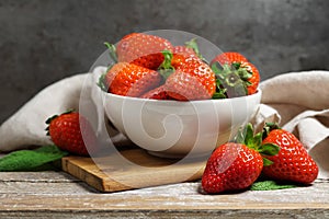 Strawberry Bowl On Wooden Table