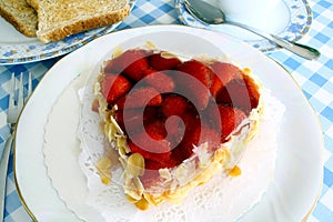 Strawberry cake with almond in heart shape with toast