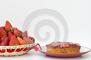 Strawberry cake and basket with fruit