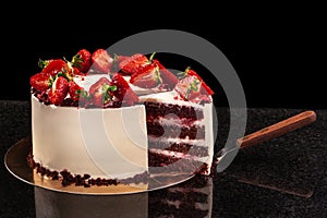 Strawberry cake on a black background. Still life