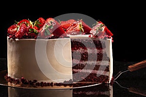 Strawberry cake on a black background. Still life