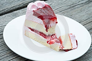 Strawberry cake and jam on white plate