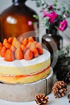 Strawberry cake on top wooden stand