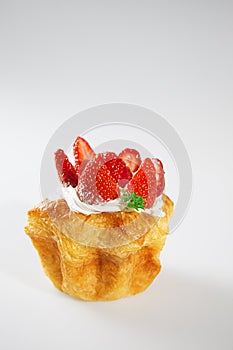 Strawberry cake on white background with vertical shoot