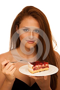 Strawberry cake - wman eats sweet dessert isolated