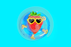 Strawberry Character in Sunglasses Floats on an Inflatable Tube