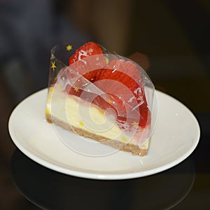 Strawberry cheese cake in plastic wrap may prompt may prompt you