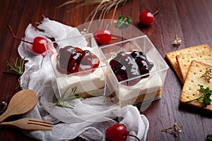 Strawberry cheese pie and Blueberry cheese pie on wooden table