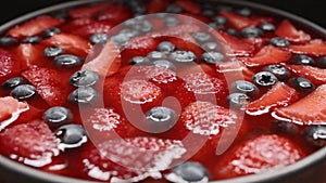 Strawberry cheesecake swirl in plate on black background