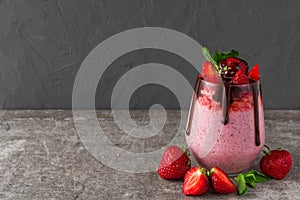 Strawberry chia seed pudding with chocolate, fresh berries and mint for healthy tasty breakfas