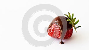 Strawberry with chocolate, hocolate flows down. One strawberry in chocolate on white background. Slow motion