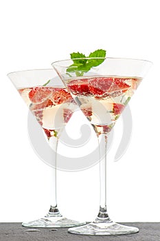 Strawberry cocktail with berry in martini glass isolated on whit