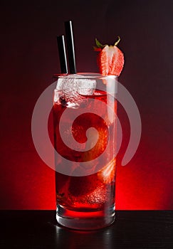 Strawberry cocktail with ice on black table