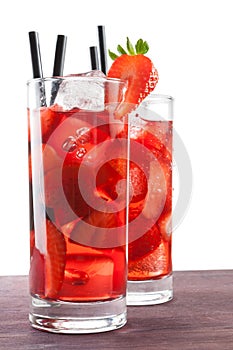 Strawberry cocktail with ice on old wood table