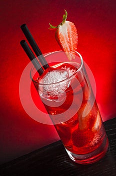 Strawberry cocktail with ice on wood table