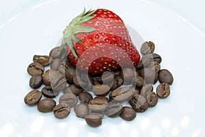 Strawberry and coffee beans. Strawberry on coffee.