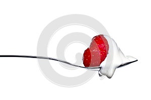 Strawberry and cream on spoon