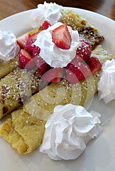 Strawberry crepes with whipped cream