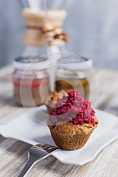 Strawberry cupcakes on a wooden table